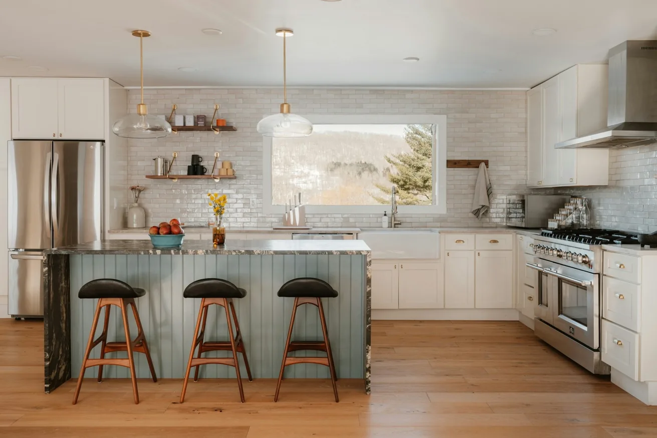 Sophisticated kitchen with custom cabinetry, island and warm editorial styling
